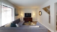 Located at 1769 Robin Ln in Lisle, Illinois, this two-floor residence offers a well-designed layout with a thoughtful blend of modern finishes and comfortable living spaces. The main level features a bright living room with wood-style flooring, large vertical-blind windows that invite natural light, and an open, inviting atmosphere. Adjacent to the living area, the dining space is highlighted by a ceiling fan with light fixture and room for a full dining set, making it well-suited for everyday meals or entertaining. The kitchen is outfitted with white cabinetry featuring matte black hardware, white countertops, and stainless steel appliances including a gas range and refrigerator, all set on wood-style flooring for a clean, contemporary look. The upper level hosts two well-proportioned bedrooms, each carpeted for comfort. One bedroom benefits from a large window with outdoor views, while both rooms offer closet storage and a relaxed, restful ambiance. The bathroom features a full soaking tub with a tiled surround, wood-style flooring, a dark wood vanity, and white countertops, presenting a clean and functional design. A staircase connects the two levels, rounding out this efficiently laid-out and move-in-ready home.