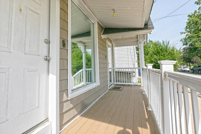 Front porch with RING doorbell, mirror window film - 492 Elm St