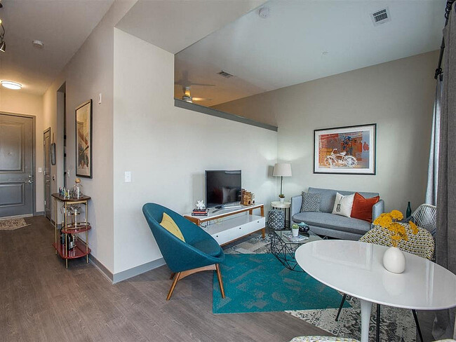 Experience the charm of this chic urban living room, designed for relaxation and style. - Eastside Heights