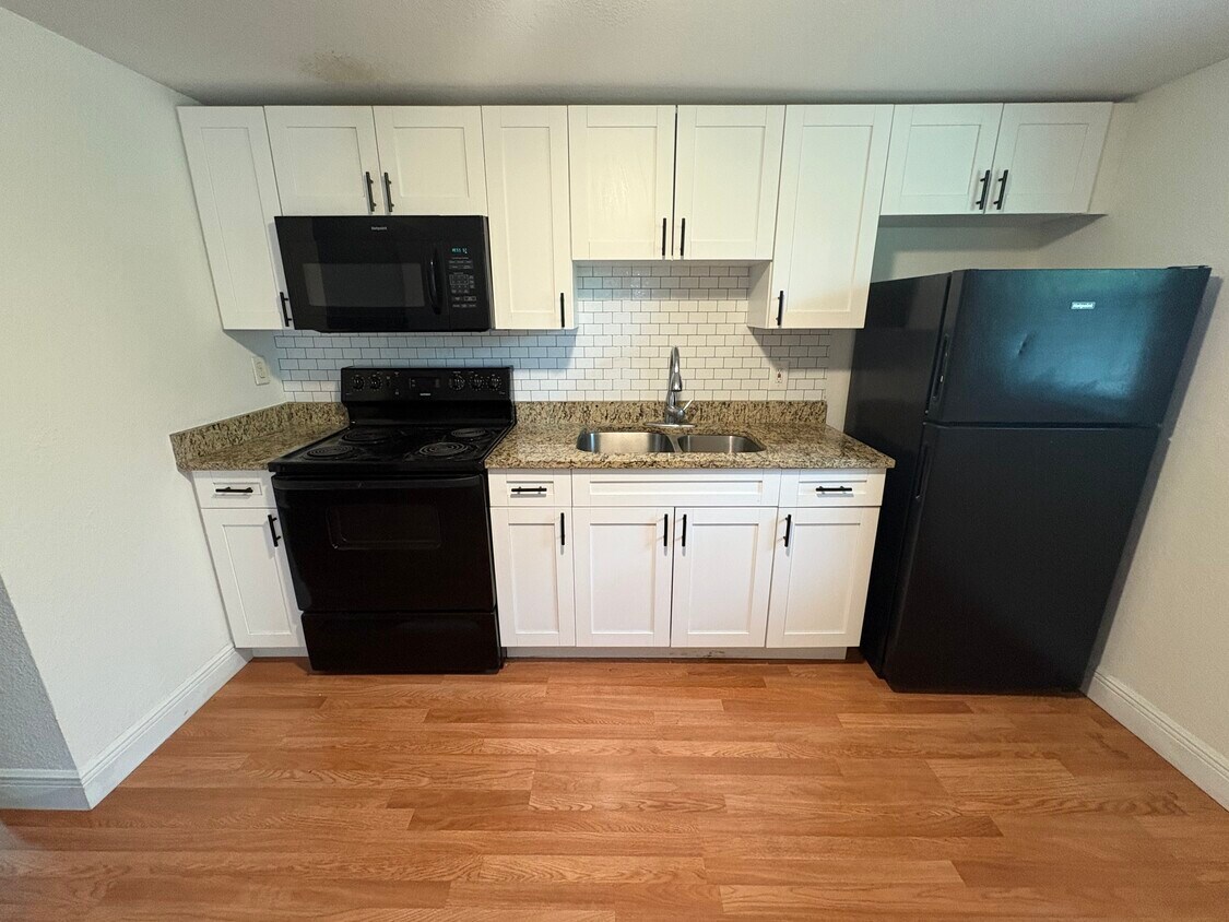 When you first walk in your front door you are greeted by a full kitchen - 10918 N Hyacinth Ave
