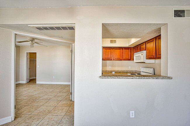 Building Photo - Cozy second floor condo located in gated c...