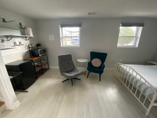 "Living room" area facing the TV in the basement unit. - 7922 Fitzroy St