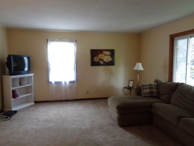 another view of living room. Now has a large, flat screen tV - 11627 Watertown Plank Rd