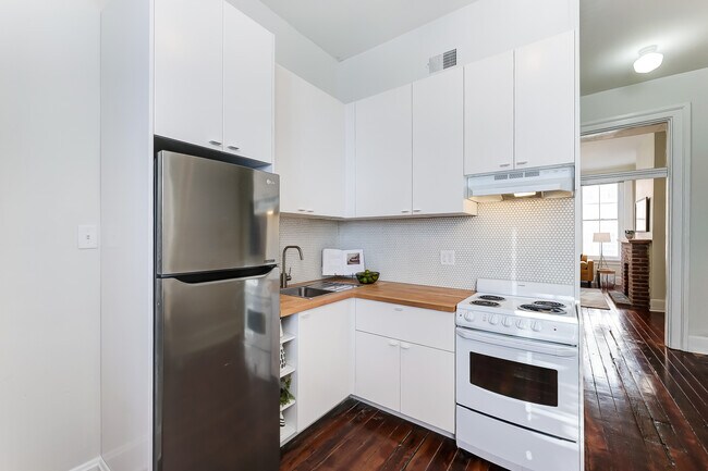 Kitchen- a great deal of cabinet space! - 309 E 13th St