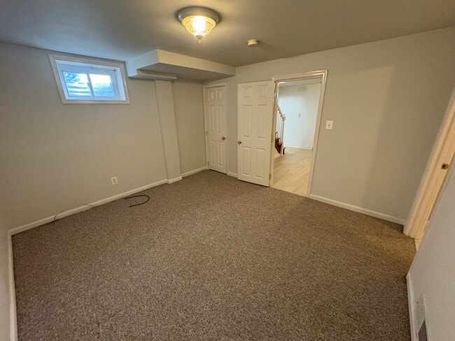 Bedroom or Living Room, with carpeting and closet - 201 E Indian Spring Dr