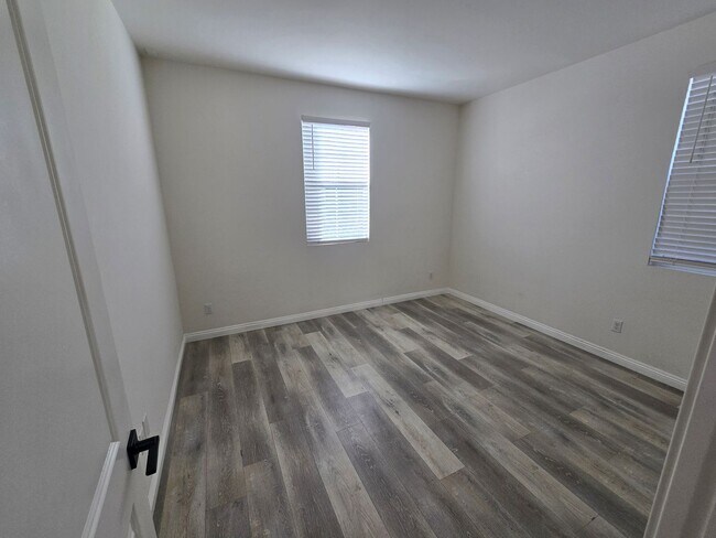 Building Photo - Open-Concept Living with Downstairs Bedroom & Enclosed Patio Retreat