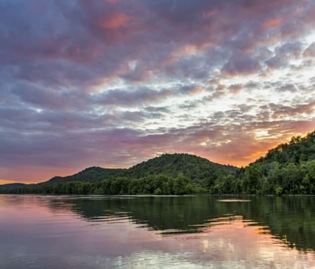 A vibrant sunset over the Ohio River