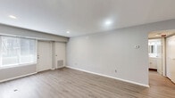 Located at 155 E Godfrey Ave in Philadelphia, PA, this one-bedroom, one-bathroom unit offers a clean, move-in-ready layout with modern updates throughout. The living area is open and bright, featuring light-toned luxury vinyl plank flooring, neutral gray walls, recessed lighting, and crisp white baseboards that create a fresh, contemporary feel. The space flows efficiently, with a well-defined living room that provides a comfortable footprint for everyday use.

The kitchen is thoughtfully appointed with white shaker-style cabinetry, gray countertops, a stainless steel sink, and a full suite of stainless appliances including a gas range, built-in microwave, dishwasher, and refrigerator. The galley-style layout maximizes function within a compact footprint.

The bedroom is a well-sized private retreat, continuing the same vinyl plank flooring and neutral palette. A large window with blinds allows natural light to fill the room, while recessed and overhead lighting provides flexibility.

The bathroom features a full-size soaking tub with shower, white tile surround, and classic fixtures in a clean, utilitarian design. Throughout the unit, consistent finishes and a cohesive neutral color scheme contribute to a tidy, understated aesthetic suited for comfortable everyday living.