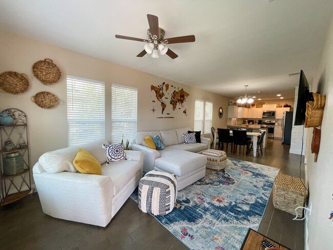 Open concept living room, dining room, and kitchen. - 422 S Olive St House