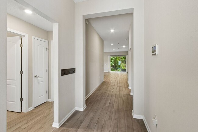 Building Photo - Modern 4BR Home with 3 Full Baths in River Glen | Screened Porch & Resort-Style Amenities