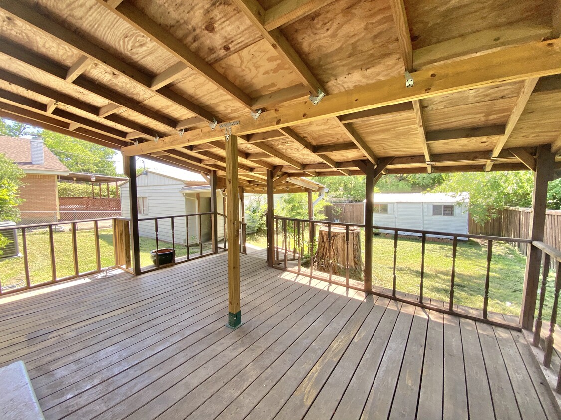 Large deck in backyard and storage unit. - 2704 Whitson Way