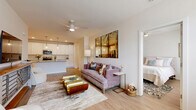 Located in Fairhope, Alabama, this thoughtfully designed 2-bedroom, 2-bathroom residence offers a bright and modern single-floor layout. The open-concept living and kitchen area serves as the heart of the home, featuring light wood-style flooring that flows seamlessly throughout. The kitchen is a standout, showcasing crisp white cabinetry, a subway tile backsplash, granite countertops, stainless steel appliances, and a central island with pendant lighting — ideal for both cooking and entertaining. The living room is airy and welcoming, with recessed lighting, a ceiling fan, and natural light pouring in through large windows. A dedicated dining nook with a glass door provides additional natural light and outdoor views. Both bedrooms are comfortably scaled, each featuring large windows that invite abundant daylight. The primary bedroom includes a spacious walk-in closet with built-in wire shelving systems offering generous storage. The bathrooms are clean and well-finished, featuring granite-topped vanities, light wood-style flooring, and a full tub-shower combination. Two dedicated closets ensure ample storage throughout the home. The overall ambiance is fresh, bright, and move-in ready.