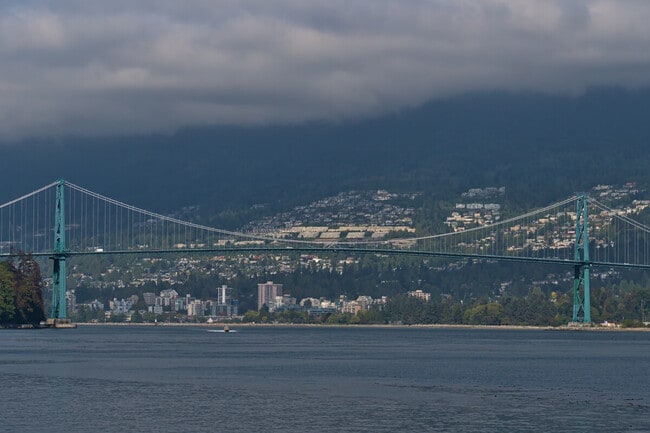 View of Lions Gate Bridge crossing Burrard Inlet in Vancouver, British Columbia, Canada with the city of West Vancouver.