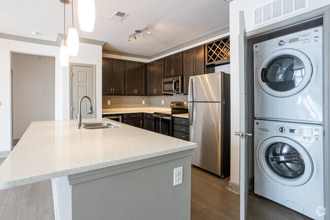 1BR, 1BA - 829 SF-897 SF - Beargrass /Rogers - Kitchen & Laundry - Axis on Lexington Apartments