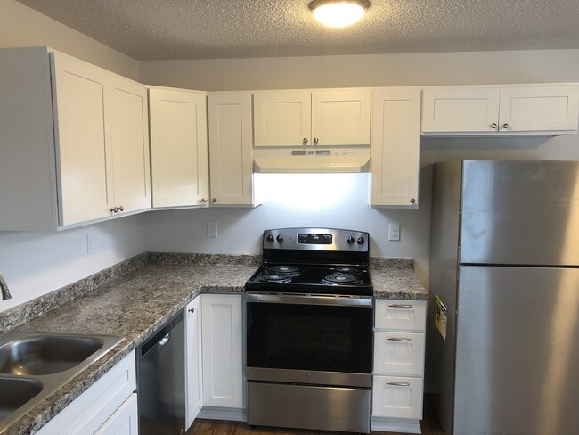 This modern kitchen features sleek stainless steel appliances - Bridgeport Terrace Apartments