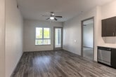 Located at 1101 N Fair Oaks Ave in Sunnyvale, CA, this well-appointed 2-bedroom, 2-bathroom residence offers a thoughtfully designed single-level layout. The open living area features wood-style flooring, a ceiling fan, and natural light streaming through large windows and a glass balcony door that leads to a private outdoor space with neighborhood views.

The kitchen is a standout feature, equipped with rich dark cabinetry, stainless steel appliances including a range, microwave, dishwasher, and refrigerator, paired with clean white countertops and a deep stainless sink — ideal for both everyday cooking and entertaining.

Both bedrooms are generously sized, carpeted for comfort, and filled with natural light from large windows. Each bedroom includes its own closet, with the primary bedroom benefiting from a spacious walk-in closet. The primary bathroom offers a dual-sink vanity with dark cabinetry and a full shower, while the second bathroom features a similarly sleek dark vanity and wood-style flooring.

Additional highlights include two hallways connecting the layout efficiently, a dedicated laundry area, and ample storage throughout. The overall aesthetic is modern and neutral, creating a clean and functional living environment in the heart of Sunnyvale.