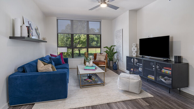 Apartment living room with wood-style flooring. - Griffis Edgemoor