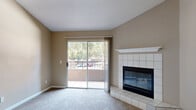 Located at 7566 Greenback Ln in Citrus Heights, CA, this one-bedroom, one-bathroom residence offers a well-organized single-floor layout designed for comfortable everyday living. The combined kitchen and living area forms the heart of the home, where vaulted ceilings lend a sense of openness and volume. The living room is anchored by a tile-surround corner fireplace with a white mantel, adding warmth and character to the space, and features sliding door access to an outdoor area, allowing natural light to flow in freely. Soft carpeting throughout the living and bedroom areas contributes to a cozy ambiance.

The kitchen is efficiently laid out with white cabinetry, granite-look countertops, wood-look vinyl plank flooring, a full suite of white appliances, and a peninsula that provides additional prep and counter space. A window brings in natural light, keeping the kitchen bright and functional.

The bedroom is a comfortable, well-proportioned retreat with carpet flooring, a window with outdoor views, and lofted ceilings that enhance the sense of space. Two closets offer generous storage, one of which is a walk-in closet outfitted with wire shelving and hanging rods for organized storage.

The bathroom features wood-look flooring, a tub-shower combination with tiled surround, a vanity with granite-look countertop, and a grab bar for added accessibility.