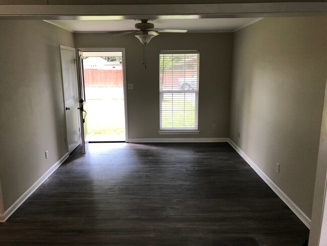 View of the living room from the dining room. - 405 Palmwood Dr