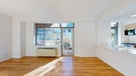 This 700 square foot apartment, located at 120 West 21 Street in New York City, offers a contemporary living experience in the heart of Manhattan. The space is efficiently designed with two bedrooms and two full bathrooms, ideal for comfortable city living. The primary bedroom, measuring 160 square feet, provides ample space for rest and relaxation.

Throughout the apartment, beautiful hardwood floors create a warm and inviting atmosphere, complemented by crisp white walls that enhance the sense of space and light. Large windows in the living area and bedrooms flood the rooms with natural light and offer picturesque views of the surrounding cityscape.

The open-concept living and dining area seamlessly connects to a modern kitchen, featuring sleek cabinetry, stainless steel appliances, and a functional island with a sink. This layout is perfect for entertaining or casual dining. Both bathrooms are well-appointed with modern fixtures, including vanities with ample storage and shower/tub combinations.

The apartment's single-floor layout ensures easy navigation and accessibility. With its prime location and thoughtful design, this apartment presents an excellent opportunity for those seeking a stylish and convenient home in one of New York's most vibrant neighborhoods.