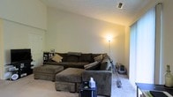 Located at 3995 Cracker Cover Ln in Canal Winchester, Ohio, this single-story home offers a practical and comfortable layout designed for everyday living. The living room serves as the centerpiece of the home, featuring vaulted ceilings that lend an open, airy feel to the space. Soft carpeting underfoot adds warmth and comfort throughout the room. A large window dressed with vertical blinds allows natural light to filter in, brightening the neutral-toned walls and creating a welcoming atmosphere. The living area provides generous space for seating and relaxation, with room for a full sectional arrangement. A textured ceiling adds a subtle architectural detail overhead. The overall ambiance of the home is cozy and understated, with a neutral color palette that provides a versatile backdrop for a variety of interior styles. The single-floor design ensures seamless flow and accessibility throughout the home, making it a practical and livable space in the Canal Winchester community.