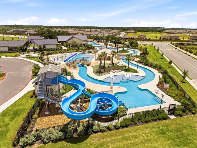 Building Photo - RESORT STYLE AMENITIES!! Multiple Pools. Lazy River. Splash Pad and Water Slides. Fitness Center....