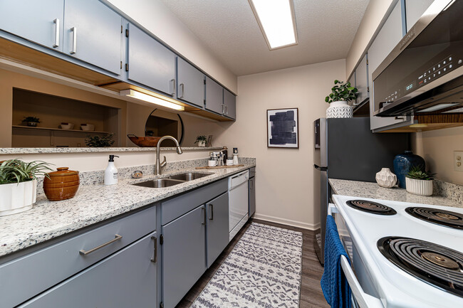 Kitchen with granite counters and modern cabinetry - The Manning