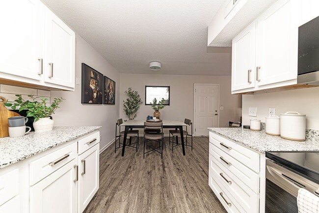 Kitchen with granite counters and modern cabinetry - The Wesley Apartment Homes