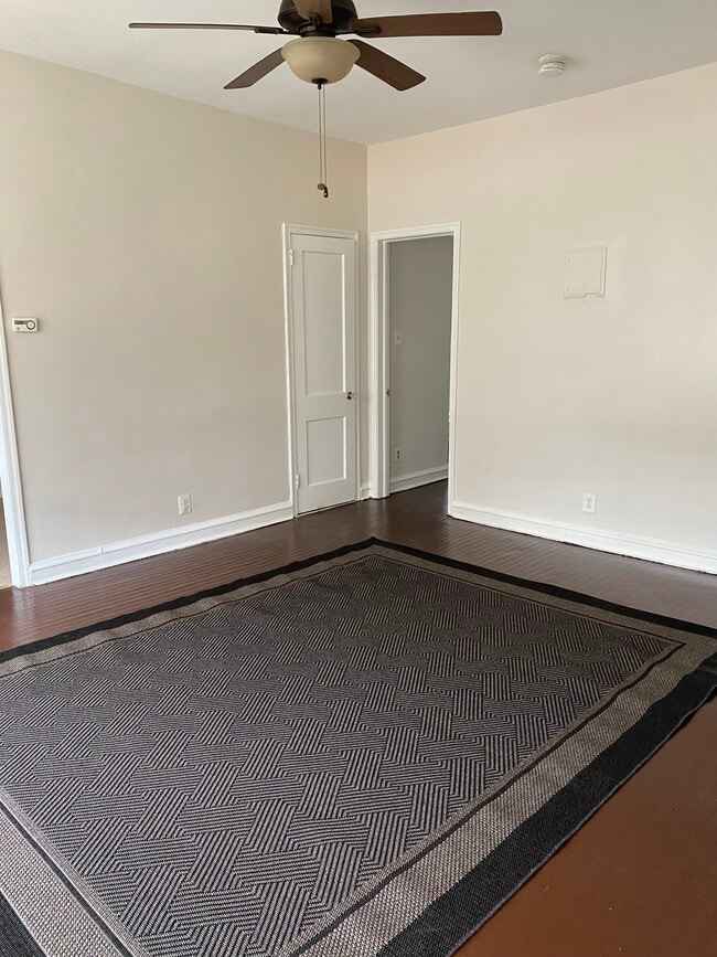 Livinroom area, new area carpet / ceiling fan. - 114 E Main St