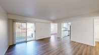 Located at 2329 Timberbrook Dr SE in Grand Rapids, MI, this 2-bedroom, 1-bathroom single-floor residence offers a clean and functional layout throughout. The open-concept living and dining area is anchored by durable hardwood-style flooring and flooded with natural light through a large sliding glass door that opens to an outdoor view, creating a bright and airy atmosphere. The adjoining kitchen features white cabinetry, granite-style countertops, a dishwasher, and an electric range, all set against light wood floors for a cohesive look. The dedicated dining area, visible from both the living room and kitchen, provides a natural flow for everyday living and entertaining. Both bedrooms are well-proportioned, featuring wood-style flooring, natural light from windows with blinds, and generous closet space—including sliding-door closets with built-in rods. The primary bedroom offers a comfortable footprint suitable for full bedroom furnishings. The full bathroom is neatly appointed with a white vanity with stone-style countertop, a tub/shower combo, and matching wood-style flooring. Additional conveniences include an in-unit laundry area, a hallway connecting the private spaces, and a total of four closets providing ample storage throughout.