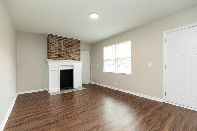 Living room with beautiful decorative fireplace. - 848 Argle Ave