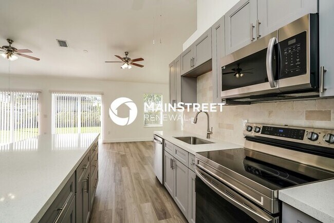 Building Photo - 4 Bedroom Pet-Friendly Home in LEHIGH ACRES, FL with Main Street Renewal