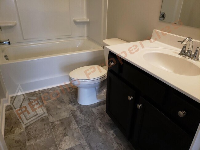 Building Photo - Beautiful Luxury 3 Story 3 Bedroom Townhome with 1st Floor Guest Suite, Attached 2 Car Garage, Co...