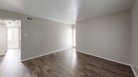 This 810 square foot apartment in Houston, TX offers a thoughtful layout with 2 bedrooms and 2 bathrooms. The space is characterized by a blend of carpeted and hardwood flooring, creating distinct zones within the home. The bedrooms feature plush carpeting, with the primary bedroom measuring a comfortable 160 square feet. Both bedrooms are equipped with ceiling fans and large windows, allowing for natural light and air circulation.

The living areas showcase sleek hardwood floors, adding a touch of elegance to the space. The kitchen, while compact, is efficiently designed with white cabinetry, black appliances, and a practical galley layout. The bathrooms are well-appointed, featuring modern fixtures and ample counter space.

Throughout the apartment, neutral-toned walls create a bright and airy atmosphere, perfect for personalizing to one's taste. The inclusion of ceiling fans in multiple rooms helps maintain a comfortable environment. Built-in closets provide essential storage solutions.

This single-story apartment combines functionality with modern comforts, making it an ideal choice for those seeking a cozy yet well-equipped living space in Houston's 77083 zip code.