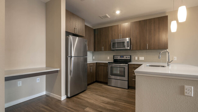 Kitchen with Stainless Steel Appliances - The Den