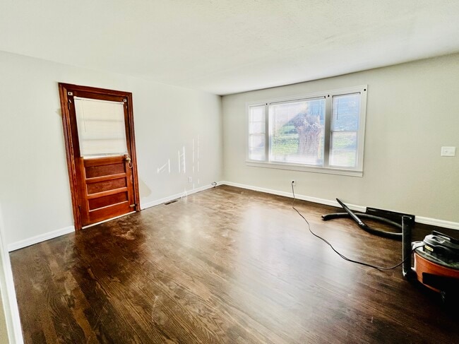 Living Room with door to side porch - 5904 Maxon Ave