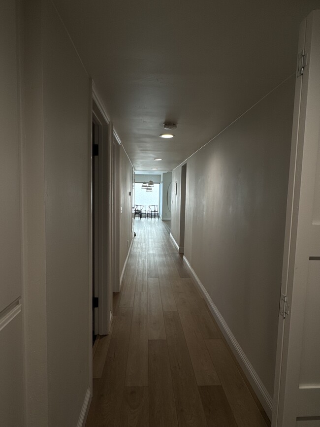 Hallway facing south towards living room and kitchen - 33821 Violet Lantern St