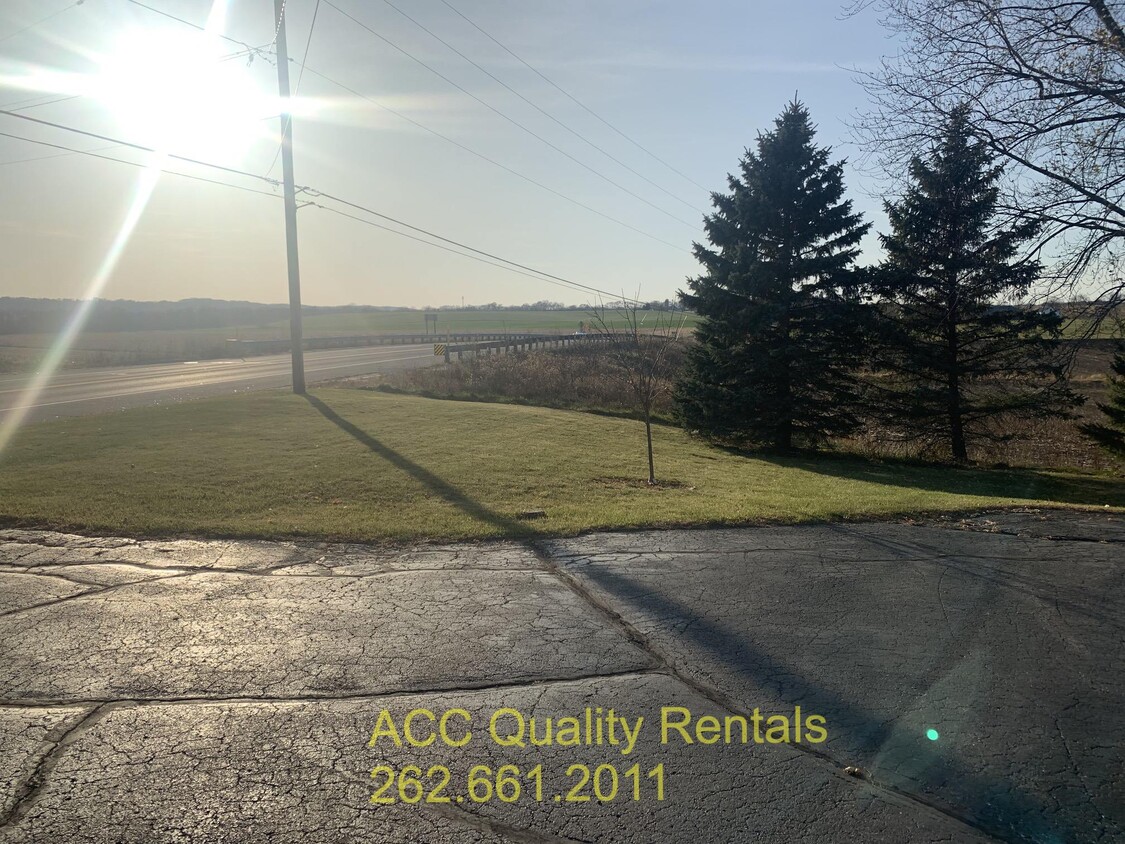 Side yard to the west of the house with mature trees - 1398 N Rd