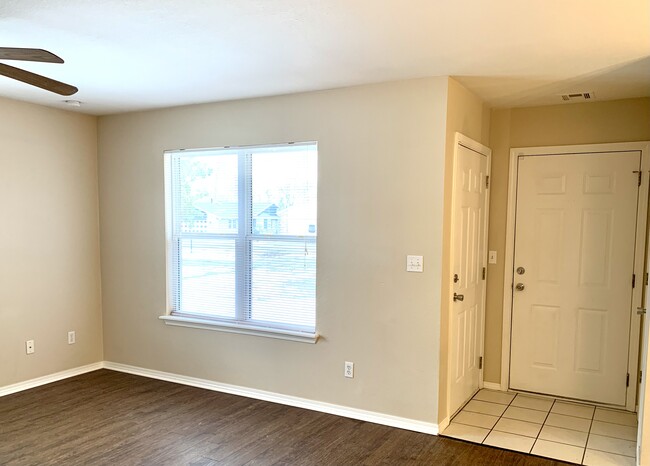 LR Front Door on left Garage Door on right - 17606 E 78th St N