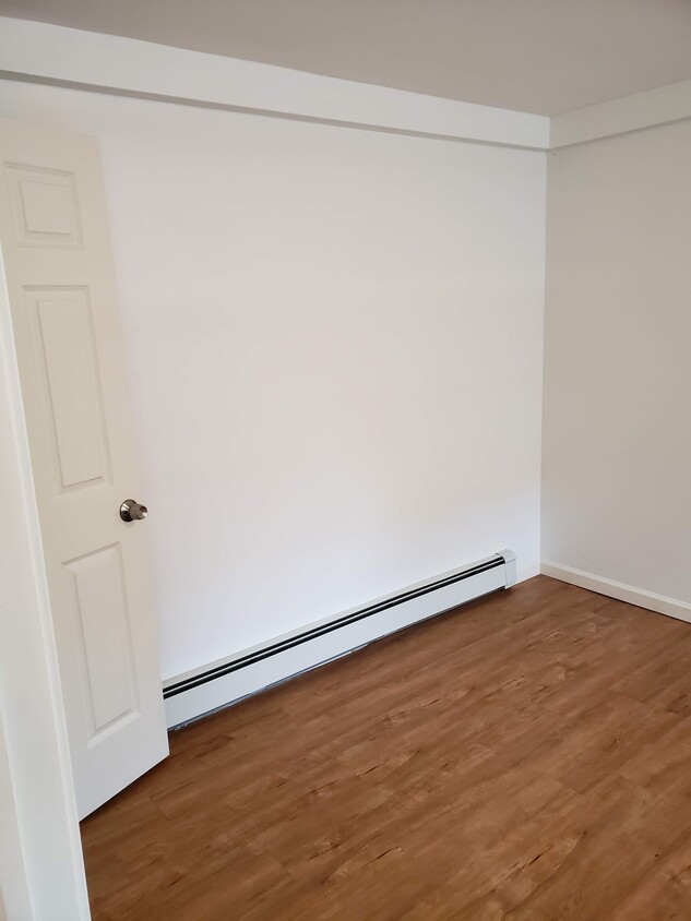 Bedroom. Measures approx 15 ft x 10 ft. Two closets. Three windows. - 2 Judson St