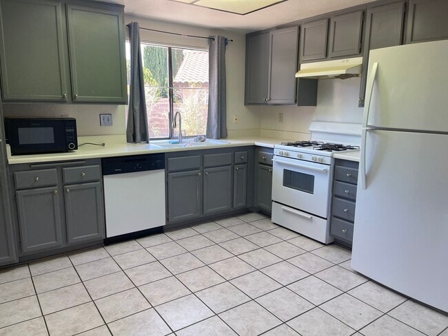 Nice kitchen with refrigerator, microwave oven dishwasher and a water dispenser - 3248 E Avenue S2