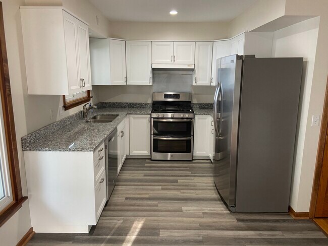 Kitchen new floor, dishwasher and refrigerator - 6505 N Shore Dr