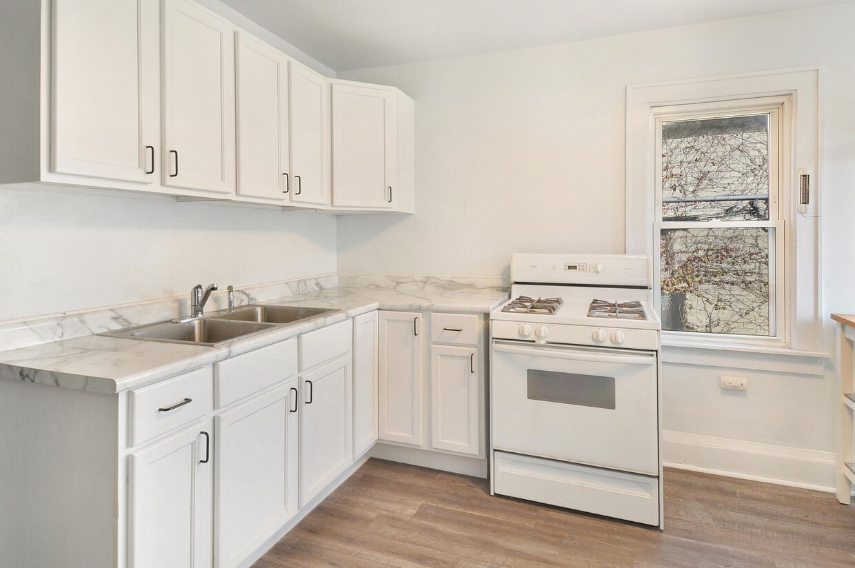 Spacious, open-concept kitchen with modern updates. - 1534 N Marshall St