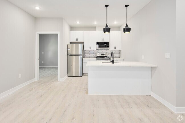 2 habitaciones, 2 baños - 850 pies cuadrados - Cocina / Comedor - 317 Kennedy St