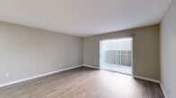This 670 square foot apartment in Houston, TX offers a thoughtful layout maximizing space and functionality. The single-story unit features one bedroom and two full bathrooms, making it ideal for individuals or couples seeking a low-maintenance lifestyle.

Upon entering, you're greeted by an open-concept living area that seamlessly combines the living room and kitchen. The space is characterized by its light, neutral color palette and durable wood-look flooring that runs throughout the apartment, creating a cohesive and modern aesthetic.

The living room is bright and airy, with ample wall space for furniture arrangement and personalization. A sliding glass door leads to a private balcony, allowing natural light to flood the space and offering an outdoor extension for relaxation or entertaining.

The kitchen, while compact, is efficiently designed with a countertop that could serve as a breakfast bar. White cabinetry and appliances maintain the apartment's clean, contemporary look.

The bedroom, measuring 150 square feet, comfortably accommodates a queen-sized bed and features a ceiling fan for added comfort. Large windows with horizontal blinds allow for plenty of natural light and privacy control.

Both bathrooms are well-appointed, with one showcasing a full-sized bathtub and shower combination. The apartment's hallway provides access to all rooms and includes a closet for additional storage.

Overall, this apartment offers a modern, low-maintenance living space with a practical layout and contemporary finishes, perfect for urban dwellers seeking comfort and convenience.