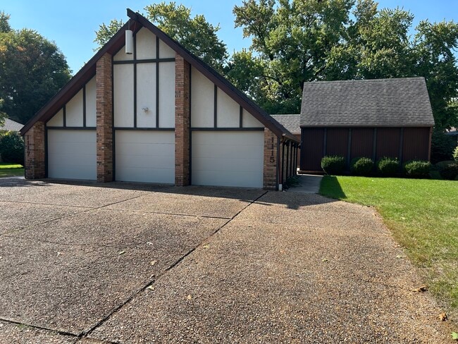 Front view showing garages - 1115 Rantoul St