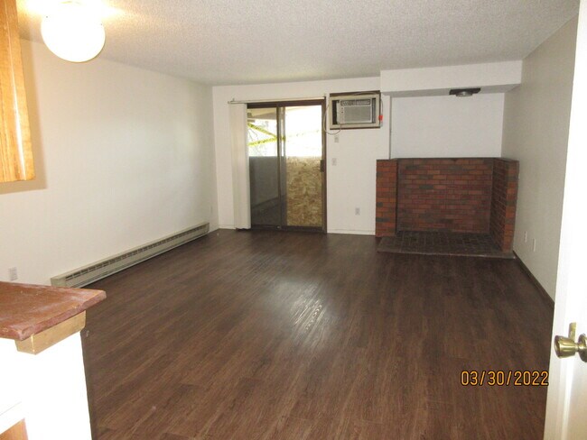 living room, new flooring, wall AC - 8737 N Colton St