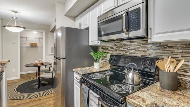 Enjoy our modern kitchens featuring granite-inspired countertops for all your culinary adventures! - Meadow Lakes