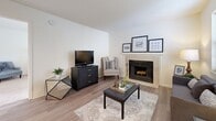 Located at 2942 Walnut St in Kansas City, MO, this one-bedroom, one-bathroom unit offers a thoughtfully designed layout across a single floor. The living room serves as a welcoming central space, featuring light hardwood-style flooring, a tiled fireplace, and a window that draws in natural light, creating a bright and comfortable atmosphere. The well-appointed kitchen is a standout, showcasing grey shaker-style cabinetry, white subway tile backsplash, granite-topped peninsula with bar seating, and a full suite of stainless steel appliances including a refrigerator, dishwasher, and microwave. Light wood flooring continues throughout the kitchen, complementing the modern aesthetic. The generously sized bedroom offers plush carpeting, a large window with outdoor views, and ample room for a full furniture arrangement. The bathroom features light wood-style flooring and clean, neutral finishes. A dedicated hallway connects the rooms efficiently, adding to the functional flow of the space. Textured ceilings and neutral wall tones throughout lend a cohesive, move-in-ready feel. This unit combines practical design with modern touches, making it an ideal home in the heart of Kansas City.