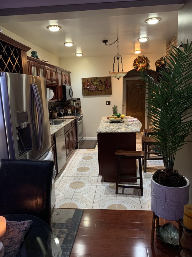 Nice open kitchen with nice stainless steel appliances - 676 E 222nd St